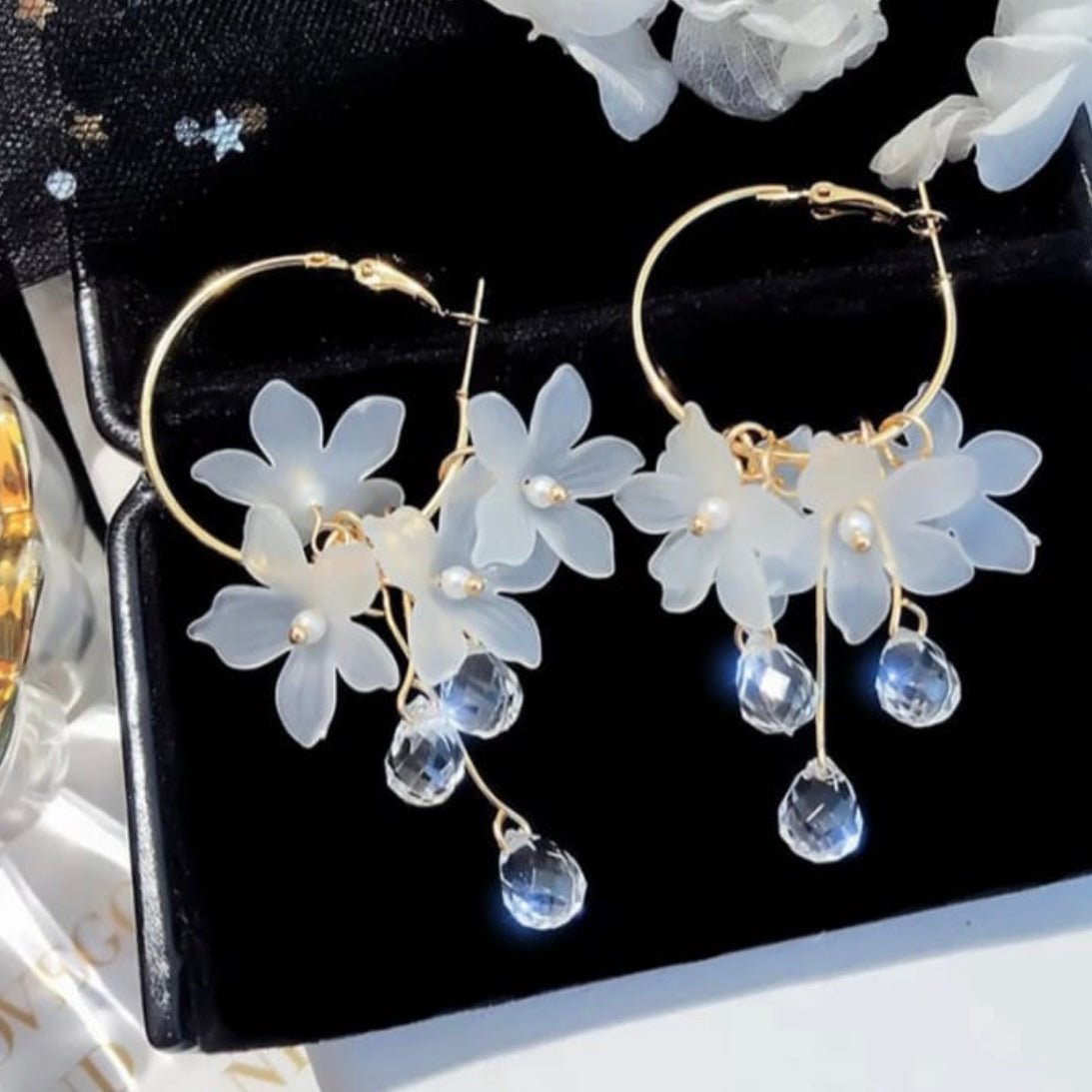 Image of an earring - Korean Earrings - White Flower Hoop Earrings by Zuzus Trove