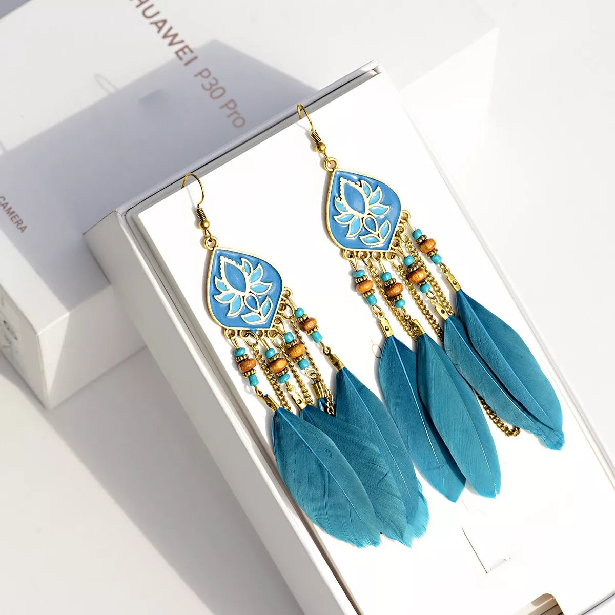 Image of an earring - Premium | Ethnic Chain Blue Lotus Feather Earrings by Zuzus Trove